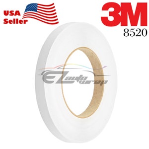 May include: A roll of white 3M 8520 tape. The tape is on a brown cardboard core.