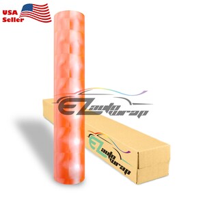 May include: A roll of orange and white checkered vinyl car wrap film. The film is on a cardboard tube with the text "EZ auto wrap" printed on it. The film is also on a cardboard box with the text "EZ auto wrap" printed on it.
