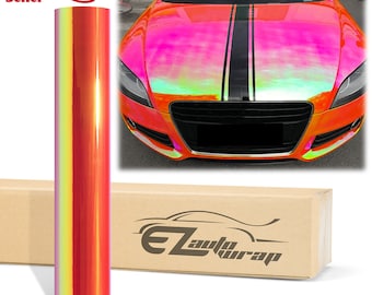 Può includere: Un rotolo di pellicola per auto in vinile iridescente rosa e arancione con una striscia nera al centro. La pellicola è mostrata su un'auto e in una scatola con l'etichetta "EZ Auto Wrap".