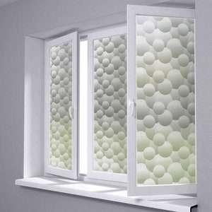 May include: A white window with a frosted glass pane featuring a pattern of overlapping circles in shades of gray and green.
