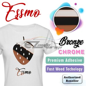 May include: White t-shirt with a brown and black strawberry graphic and the text "Essmo" printed on the front. The t-shirt is a promotional item for a vinyl wrap company. The text "Bronze Chrome" is printed in a pink box, "Premium Adhesive" is printed in a green box, "Fast Weed Technology" is printed in a purple box, and "Authorized Reseller" is printed in a pink box.