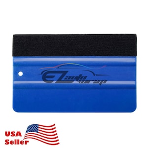 May include: Blue plastic squeegee with a black felt edge. The squeegee has a rounded handle and a smooth surface. It is used for applying vinyl wraps and decals to surfaces.