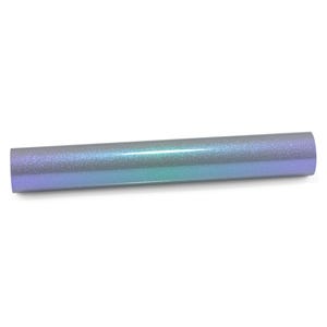 May include: A cylindrical roll of craft vinyl featuring a smooth, glittery finish that transitions between shades of iridescent purple, blue, and teal. The surface has a fine, reflective texture that catches the light, creating a gradient effect.