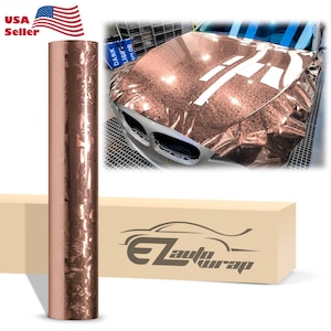 May include: A roll of rose gold car wrap vinyl with a textured finish. The vinyl is shown wrapped around the hood of a car. The car wrap is available in a variety of colors and finishes.