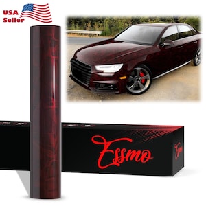 May include: A roll of burgundy-colored car wrap with a wood grain pattern. The image also shows a burgundy car with the same wrap applied. The box with the logo "Essmo" is also visible.