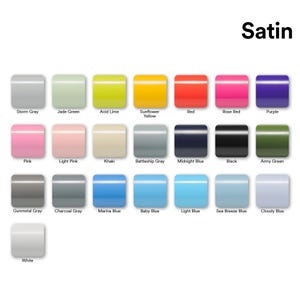 May include: A color chart titled Satin displaying twenty-two rectangular swatches in various shades including Storm Gray, Jade Green, Acid Lime, Sunflower Yellow, Red, Rose Red, Purple, Pink, Light Pink, Khaki, Battleship Gray, Midnight Blue, Black, Army Green, Gunmetal Gray, Charcoal Gray, Marina Blue, Baby Blue, Light Blue, Sea Breeze Blue, Cloudy Blue, and White.