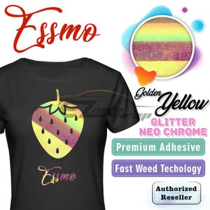 May include: A black t-shirt with a yellow and pink glitter strawberry design. The text "Essmo" is printed on the shirt. The image also shows a sample of the glitter material in a circle with the text "Golden Yellow Glitter Neo Chrome" and "Premium Adhesive" and "Fast Weed Technology" and "Authorized Reseller".