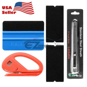 May include: A set of vinyl wrap tools including a blue squeegee with a black felt edge, a red vinyl cutter, two black felt applicators, and a black utility knife with a lockable sheath and a 30 degree acute blade.