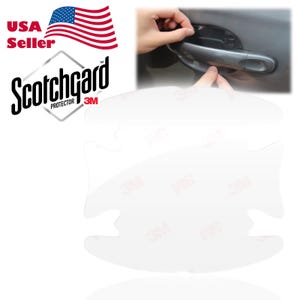 May include: A clear plastic car door handle protector with the 3M Scotchgard Protector logo. The protector is designed to fit over a car door handle to prevent scratches and damage.