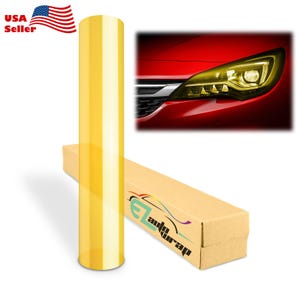 May include: A roll of translucent yellow adhesive film for automotive headlights, accompanied by a rectangular cardboard shipping box labeled with the text EZ Auto Wrap, and a small graphic showing a red car headlight tinted with the yellow film.
