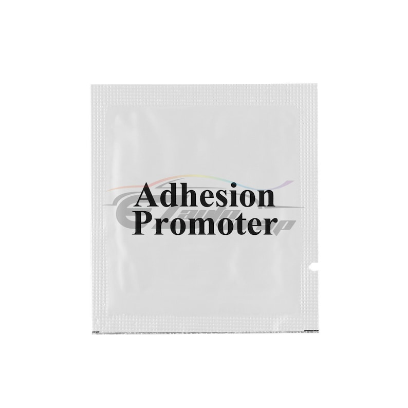 May include: A white, single-use packet with the text "Adhesion Promoter" printed in black.
