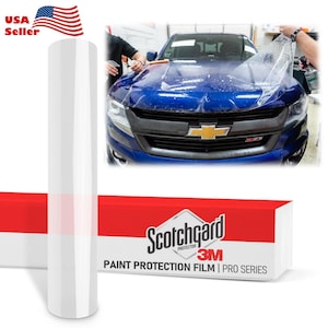 May include: A roll of clear paint protection film next to a blue car with a gold emblem. The film is being applied to the car's hood. The box reads "Scotchgard Paint Protection Film 3M Pro Series."