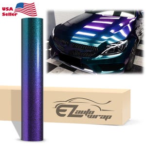 May include: A roll of vinyl car wrap film featuring a color-shifting gradient from teal to deep purple with a fine glitter finish. The roll is positioned next to a box labeled EZautowrap and an image of a car with the same color-shifting wrap.