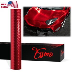 May include: A roll of red carbon fiber vinyl wrap with a textured pattern. The image also shows a red sports car and a black box with the word "Essmo" in red script. The American flag and the words "USA Seller" are in the upper left corner.
