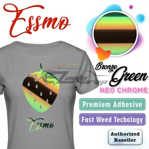 May include: A gray t-shirt featuring a strawberry design with bronze, green, and brown stripes. The shirt has the word "Essmo" in red script at the top and bottom. Additional text includes "Bronze Green Neo Chrome", "Premium Adhesive", and "Fast Weed Techology".
