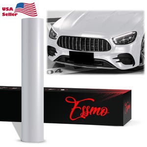 May include: A roll of white vinyl wrap stands next to a white car. The car's front grill and headlights are visible. A black box with the red text "Essmo" is at the bottom left. The American flag and "USA Seller" text are in the top left.