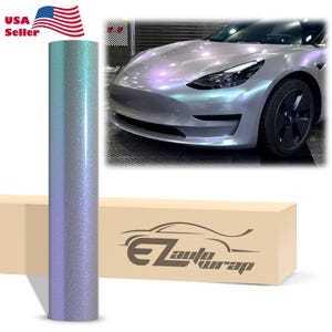 May include: A roll of iridescent, color-shifting vinyl car wrap film with a fine glitter texture. The film transitions between shades of light blue and purple. A beige box features the text EZAutoWrap and a graphic of a car silhouette.