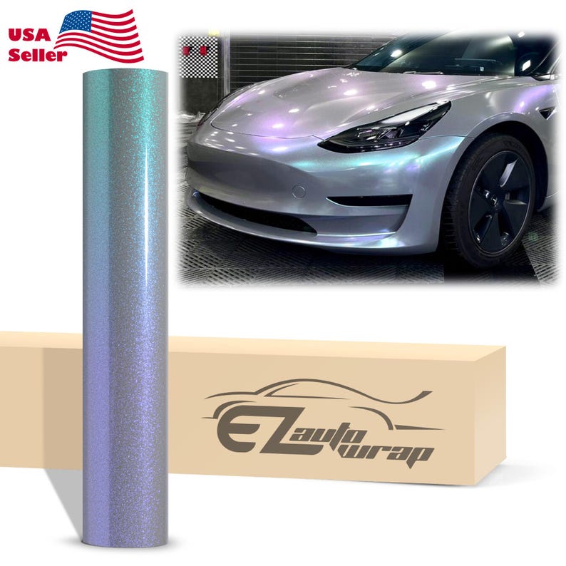 May include: A roll of iridescent, color-shifting vinyl car wrap film with a fine glitter texture. The film transitions between shades of light blue and purple. A beige box features the text EZAutoWrap and a graphic of a car silhouette.
