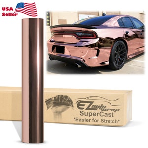 May include: A roll of rose gold chrome vinyl wrap film. The film is shown next to a car wrapped in the same vinyl. The box reads "EZ Auto Wrap SuperCast *Easier for Stretch*"