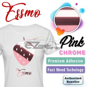 May include: White t-shirt featuring a pink strawberry design with a dark red top and white seeds. The word "Essmo" is written in red script at the top and bottom. The words "Pink Chrome", "Premium Adhesive", and "Fast Weed Techology" are also visible.