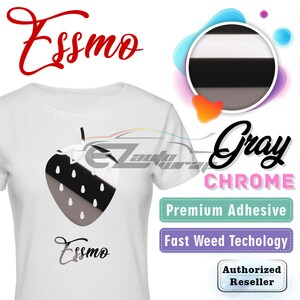 May include: White t-shirt with a black and white strawberry graphic and the text "Essmo" printed on the front. The shirt is a promotional item for Essmo Gray Chrome Premium Adhesive.