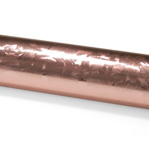 May include: A roll of rose gold wrapping paper with a metallic finish and a subtle pattern.