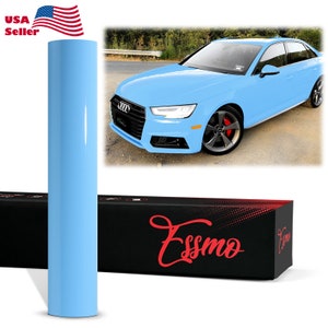 May include: A roll of light blue vinyl wrap with a car wrapped in the same color vinyl. The car is a blue sedan with black wheels and red brake calipers. The vinyl wrap is packaged in a black box with the word "Essmo" in red lettering.
