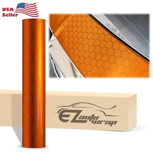 May include: Orange honeycomb vinyl wrap roll with a car application example. The roll is 12 inches wide and 5 feet long. The vinyl is a high-quality, durable material that is easy to apply and remove. It is perfect for adding a unique look to your car, truck, or motorcycle.