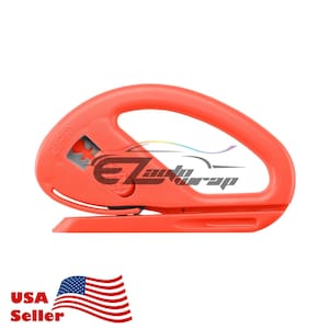 May include: A red plastic vinyl cutter with a handle and a blade. The cutter has the word "ZIPPY" printed on the side.