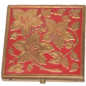Mid Century Rex Fifth Avenue Brass Compact Embossed Flowers Red Lucite Background