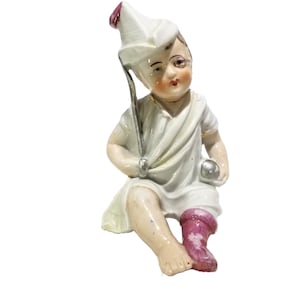 Vintage Piano Baby Hand Painted Porcelain Figurine Boy in Sock Holding Toy Ball & Stick