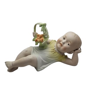 Duitse porseleinen bisque-piano Baby Carl Schneider Child met fruitmand