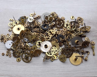 Lots of small gears/nuts/parts in a tin box Parts of old Clock/equipment Brass-Bronze-Copper Steampunk components/supplies