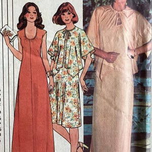May include: A sewing pattern illustration featuring three outfits: a solid coral floor-length dress, a floral print knee-length dress with a matching capelet, and a solid beige floor-length dress with a capelet. The text A and B labels are visible.