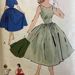May include: Vintage fashion illustration featuring three dress designs. One dress is blue with a matching jacket, another is a light green dress, and the third is a red dress with a bow. The illustration is labeled with the text "young fashionables".