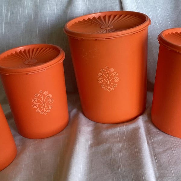 Set of 4 vintage Tupperware canisters with Servalier Sunburst lids, Orange
