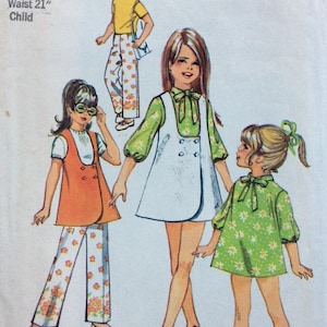 May include: Illustration of children's clothing patterns from the 1970s. The designs include a white dress with a green floral top, an orange vest with floral pants, and a yellow shirt with floral pants. The size is 4, with a 23-inch breast and a 21-inch waist.