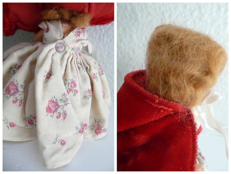 Puede incluir: Una mu&ntilde;eca vintage que lleva un vestido blanco con estampado floral y una capa de terciopelo rojo. La mu&ntilde;eca tiene el pelo largo y casta&ntilde;o.