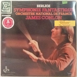May include: A vinyl record album featuring the work of Berlioz, titled "Symphonie Fantastique," performed by the Orchestre National de France, conducted by James Conlon. The album cover has a portrait of the conductor.