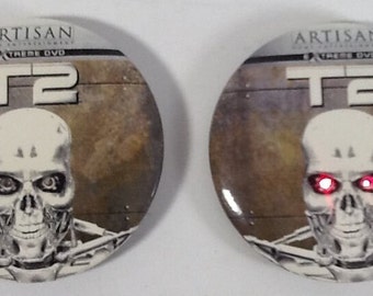 VINTAGE Terminator 2 Buttons Lot of Two (2) Eyes Light Up T2 Artisan Home Entertainment Extreme DVD 2-1/4" Diameter