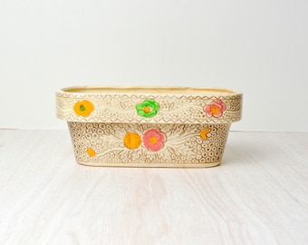 Jardinière oblongue avec fleurs multicolores