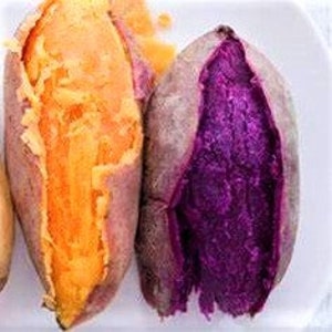 May include: Two cooked sweet potatoes, one orange and one purple, are shown on a white surface. The orange sweet potato is cut open, revealing its bright interior. The purple sweet potato is also cut open, displaying its vibrant purple flesh.