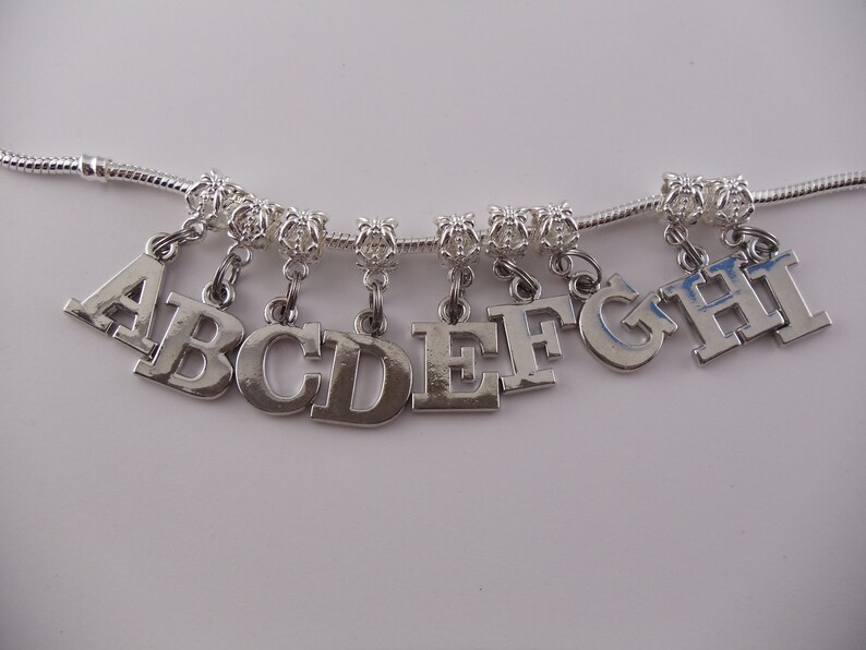 Letter charms ready for your bracelet. These already have the Etsy