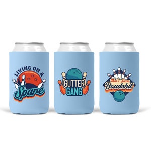 May include: Three blue and white can coolers with bowling-themed designs. The first cooler says "Living on a Spare". The second cooler says "Gutter Gang". The third cooler says "That's some Bowlshit".