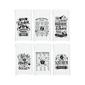 May include: Set of six black and white kitchen towels with whimsical text and illustrations. The towels feature phrases like "This Kitchen is Guarded by Magical Cats", "The Secret Ingredient is Always Love", and "Bless This Magic Kitchen".