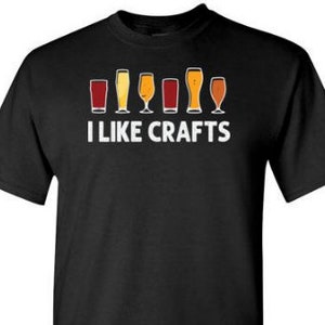 May include: Black t-shirt with a white graphic of a row of beer glasses and the text "I like crafts".