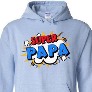May include: Light blue hooded sweatshirt with a comic book style graphic that says "SUPER PAPA" in red and blue letters.