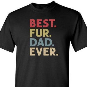 May include: Black t-shirt with the text "BEST. FUR. DAD. EVER." in a vintage style font with red, yellow, and blue colors.