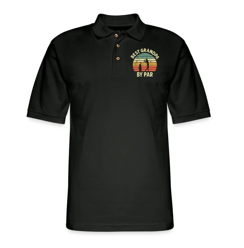 May include: Black polo shirt with a vintage-style graphic of a golfer and the text "Best Grandpa By Par".