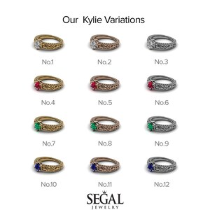 May include: Twelve variations of a gold, rose gold, and silver ring with different colored gemstones. The ring has a detailed, intricate design. The gemstones are a diamond, ruby, emerald, and sapphire.